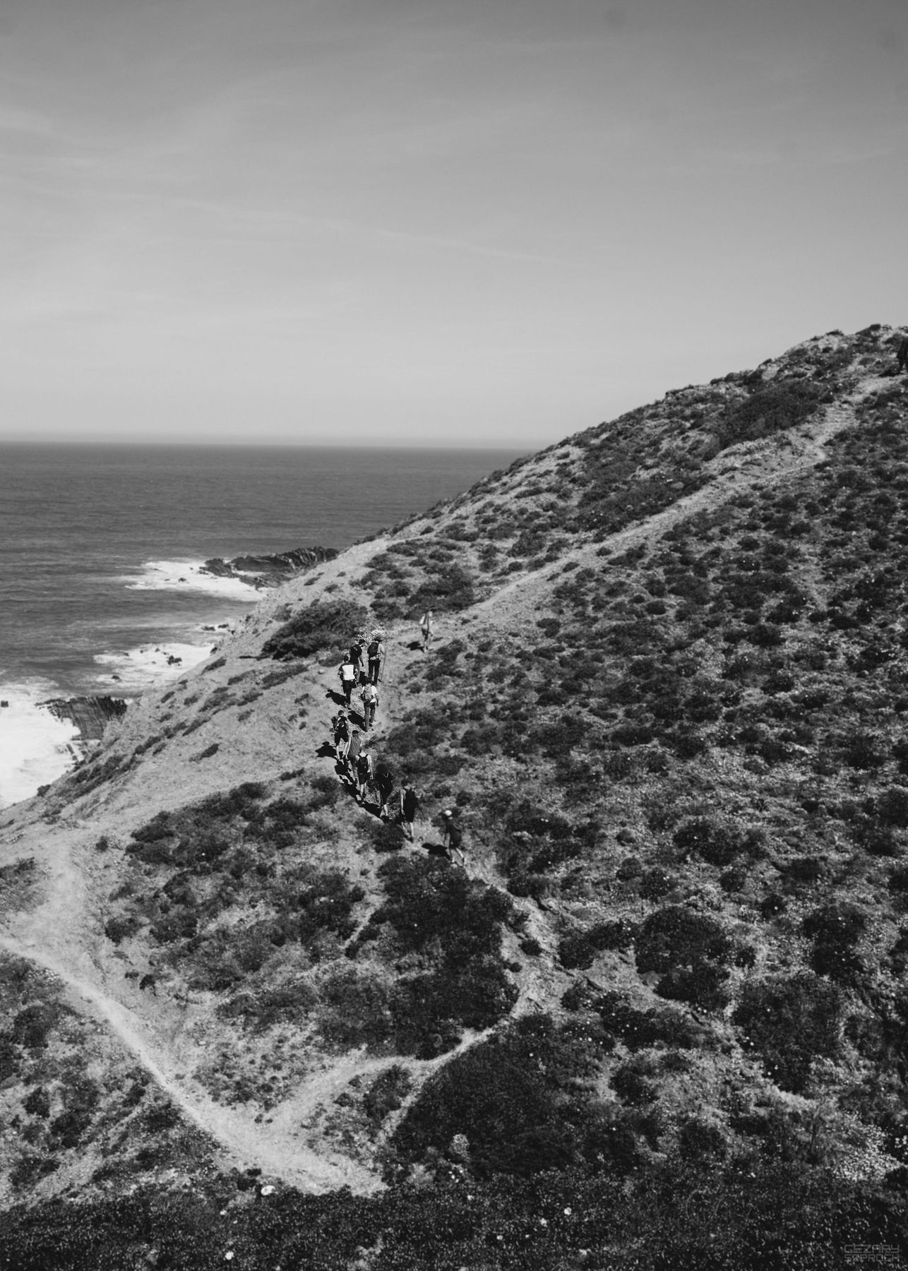 Men sitting in circle on the land